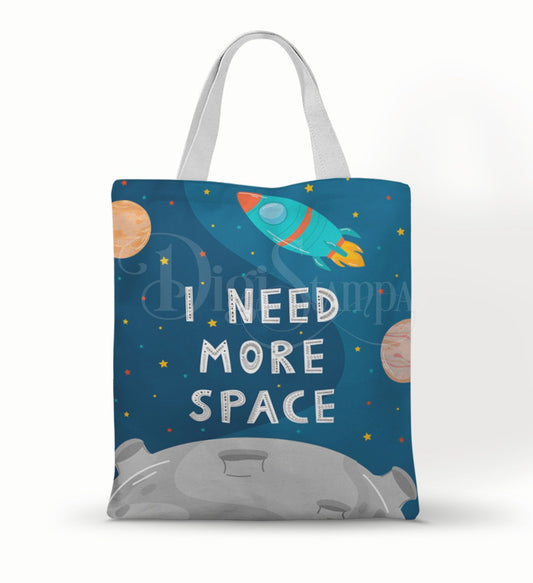 Ecobag personalizada Espaço: azul com foguete e escritas, com alças.